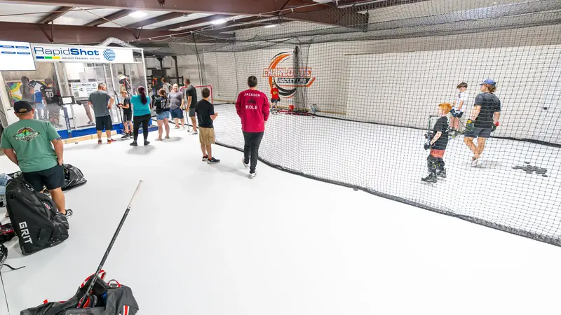 Players and parents spread across the synthetic ice training areas at Charlotte Hockey Lab
